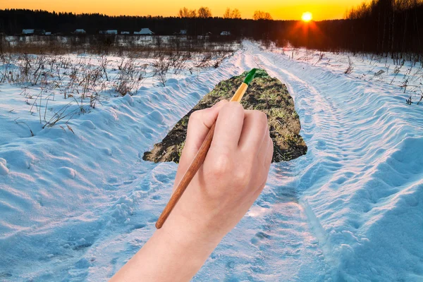 Sunset under snowcovered country road — Stock Photo, Image