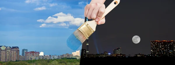 Paintbrush paints day city from night time — Stock Photo, Image