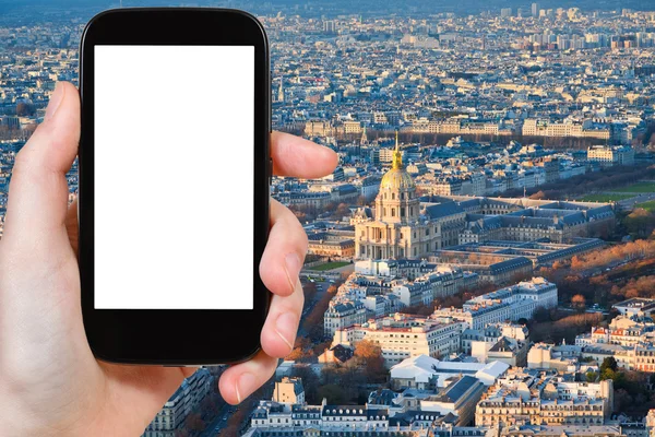 Smartphone with cut out screen and Paris cityscape — Stok fotoğraf