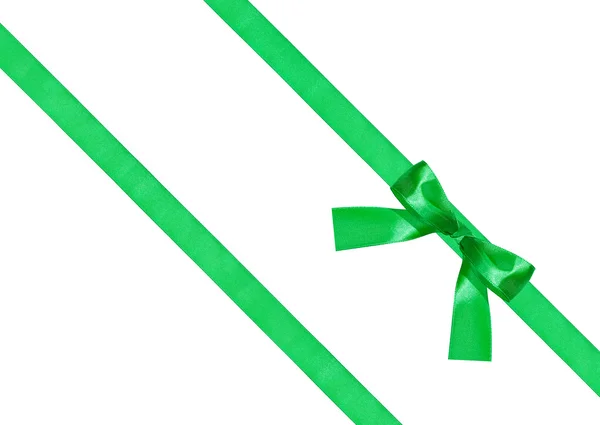 One green bow knot on two diagonal silk ribbons — Stock Photo, Image