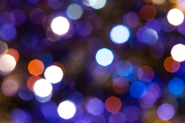 Donker blauw en violet twinkling Christmas lights — Stockfoto