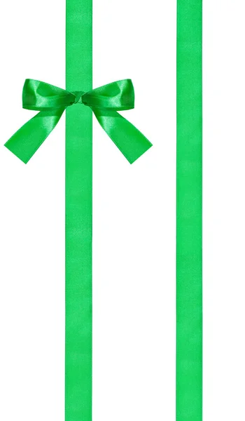 One green bow knot on two parallel satin ribbons — Stock Photo, Image