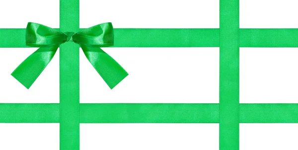 Um grande nó de arco verde em quatro fitas de cetim — Fotografia de Stock