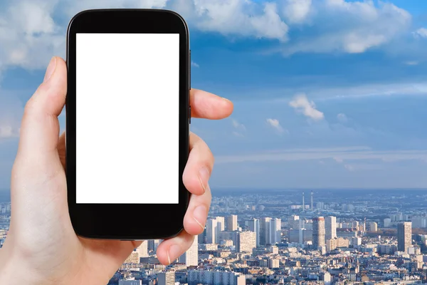 Smartphone with cut out screen and Paris panorama — Stock Photo, Image