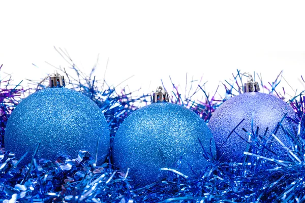 Few blue Christmas baubles and tinsel isolated — Stock Photo, Image
