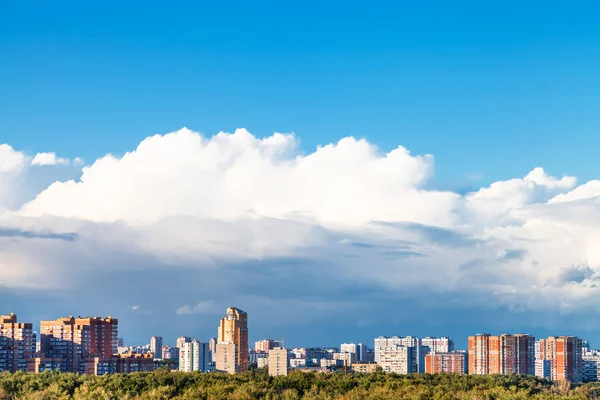 Large low white cloud over residential district — Stock Photo, Image