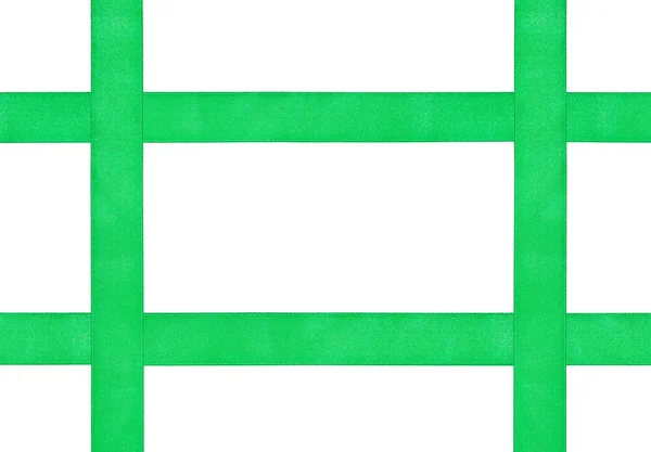 Quatro fitas de seda verde cruzadas isoladas — Fotografia de Stock