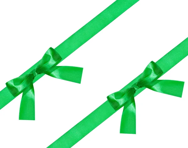 Two big green bow knot on two diagonal satin bands — Stock Photo, Image