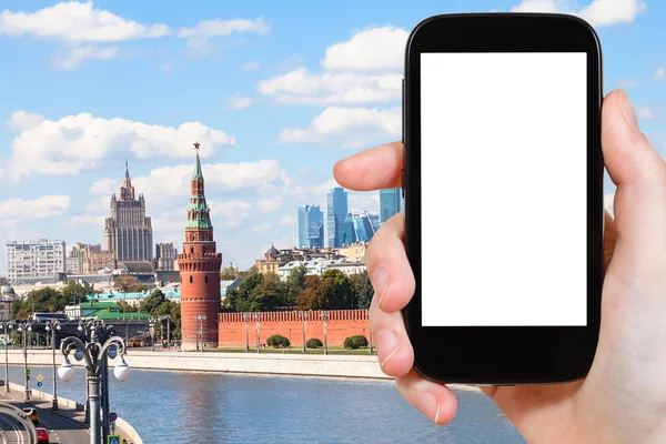 Smartphone with cut out screen and Moscow landmark — Stock Photo, Image