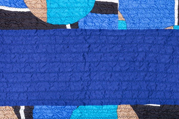 Stitched crumpled blue silk fabric and patchwork — Stock Photo, Image