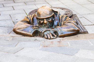 Bronze figure of Cumil the Peeper in Bratislava
