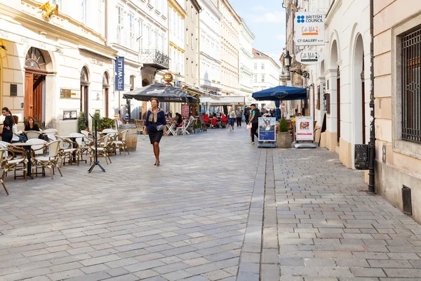 People walk on Venturska street in Bratislava — Stock fotografie