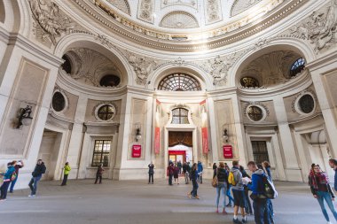 Tourist in courtyard of Hofburg Palace in Vienna