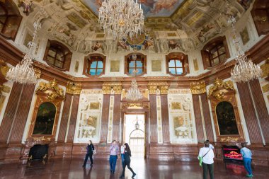 tourists in hall of Upper Belvedere Palace, Vienna