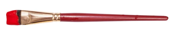Pennello artistico piatto con punta dipinta di rosso — Foto Stock