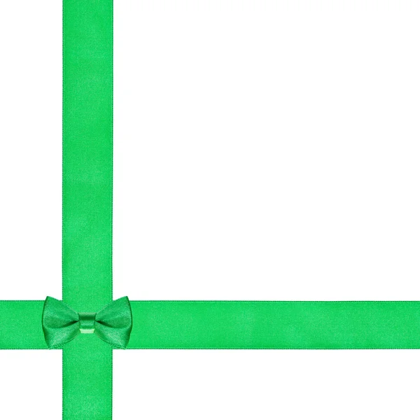Um pequeno nó de arco em duas fitas de seda que cruzam — Fotografia de Stock