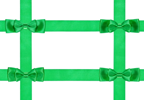 Cuatro nudos de lazo verde doble en cuatro cintas de satén —  Fotos de Stock