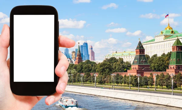 Smartphone with cut out screen and Moscow city — Stock Photo, Image