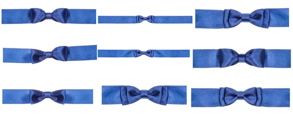 Uppsättning av blå båge knop på satin band isolerade — Stockfoto