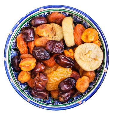 above view of dried fruits in bowl isolated clipart