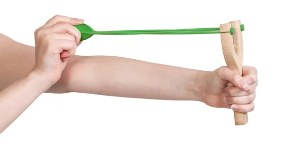 Hands pull rubber band of slingshot isolated — Stock Photo, Image