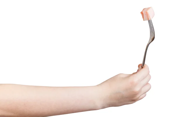 Handen håller gaffel med spetsade bit ister — Stockfoto