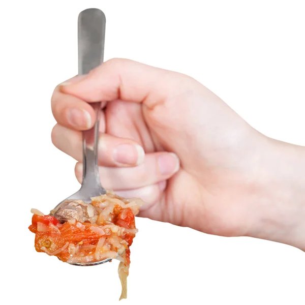 Hand holding tablespoon with cabbage soup isolated — Stock Photo, Image