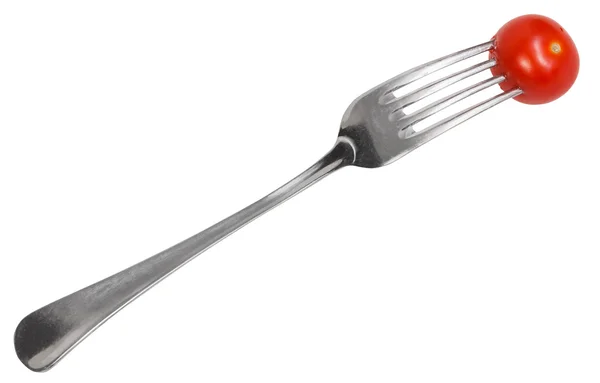 Dinning fork with impaled cherry tomato — Stock Photo, Image