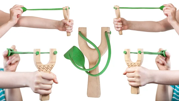 Set of female hands with wooden slingshot — Stock Photo, Image