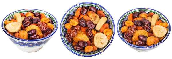 Set of traditional ceramic bowls with dried fruits — Stock Photo, Image