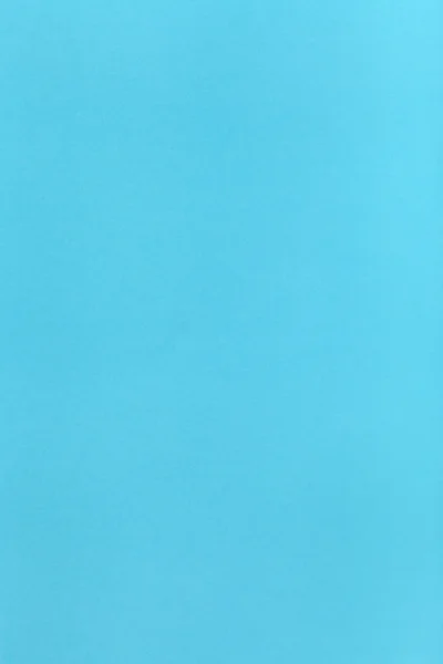 Licht blauw gekleurde verticale vel papier — Stockfoto