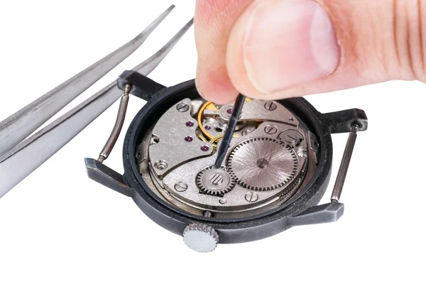 Watchmaker repairs old watch isolated on white — Stock Photo, Image