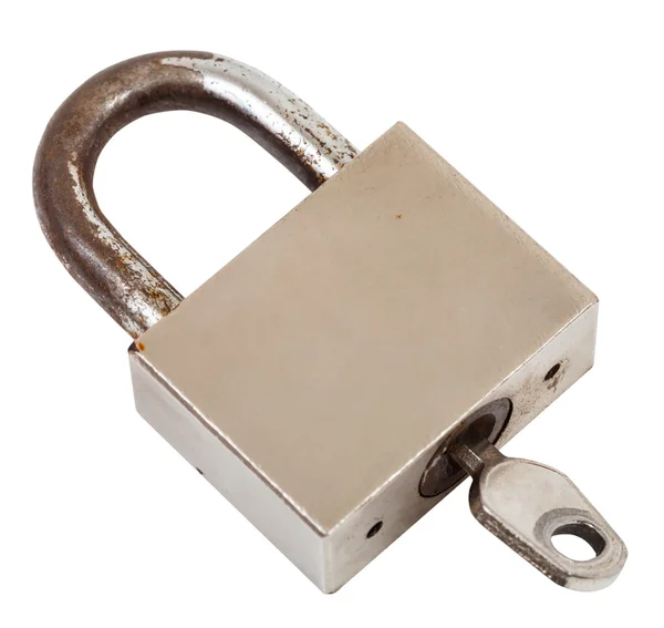 Closed steel old padlock with key isolated — Stock Photo, Image