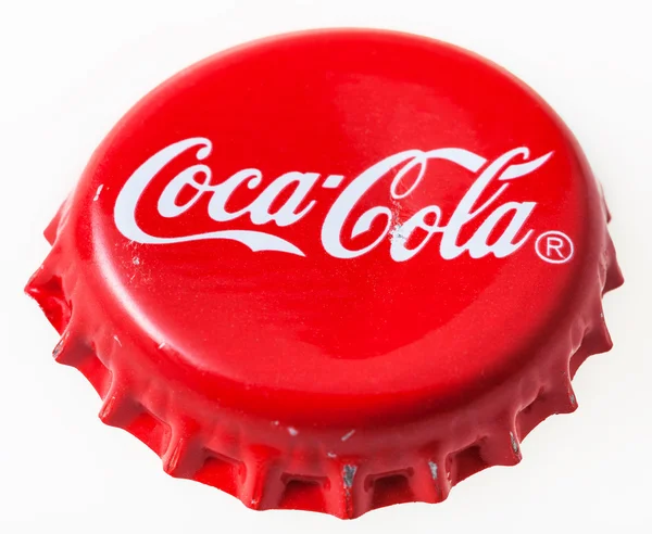 Used red crown cap from the bottle of Coca-Cola — Stock Photo, Image