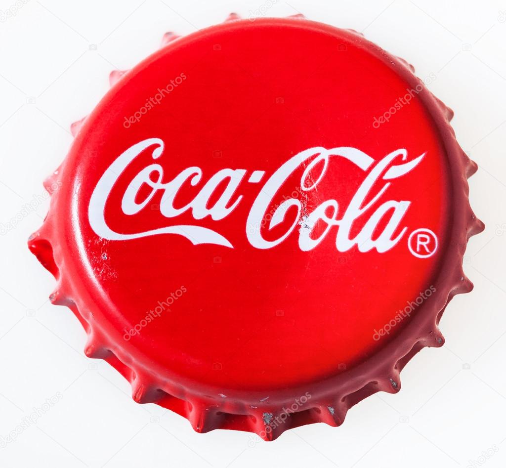 MOSCOW, RUSSIA - DECEMBER 12, 2105: top view of used red cap from the glass bottle of Coca-Cola. The Coca-Cola Company is an American beverage corporation and manufacturer founded in 1886.