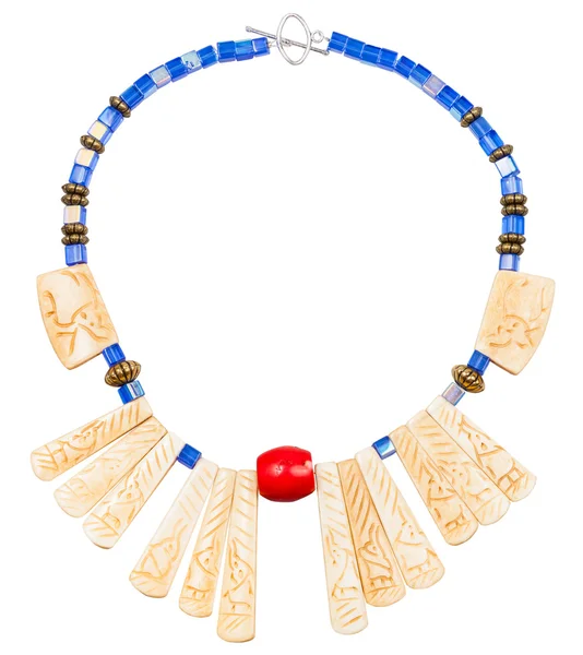Necklace from carved bone and blue glass beads — Stock Photo, Image
