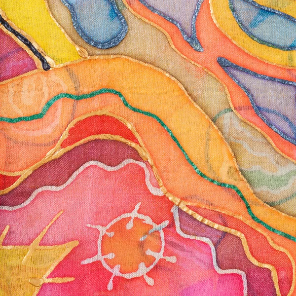 Yellow, red, blue abstract pattern on silk batik — Stock Photo, Image