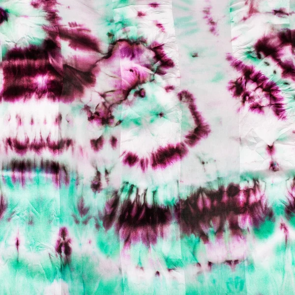 Magenta en groen vlekken op nodulair batik — Stockfoto