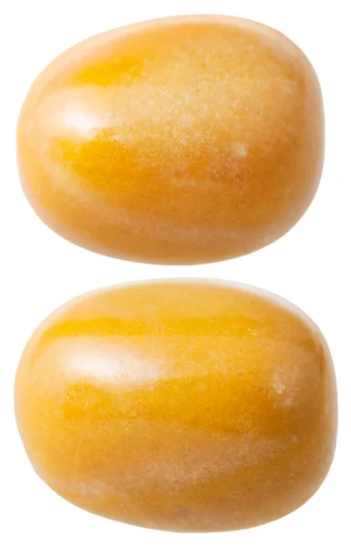 Duas pedras preciosas jaspe amarelas isoladas — Fotografia de Stock