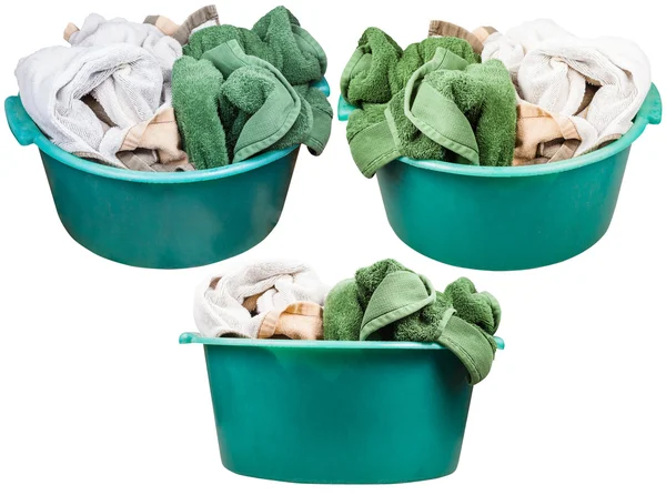 Set of round green plastic washbasins with towels — Stock Photo, Image