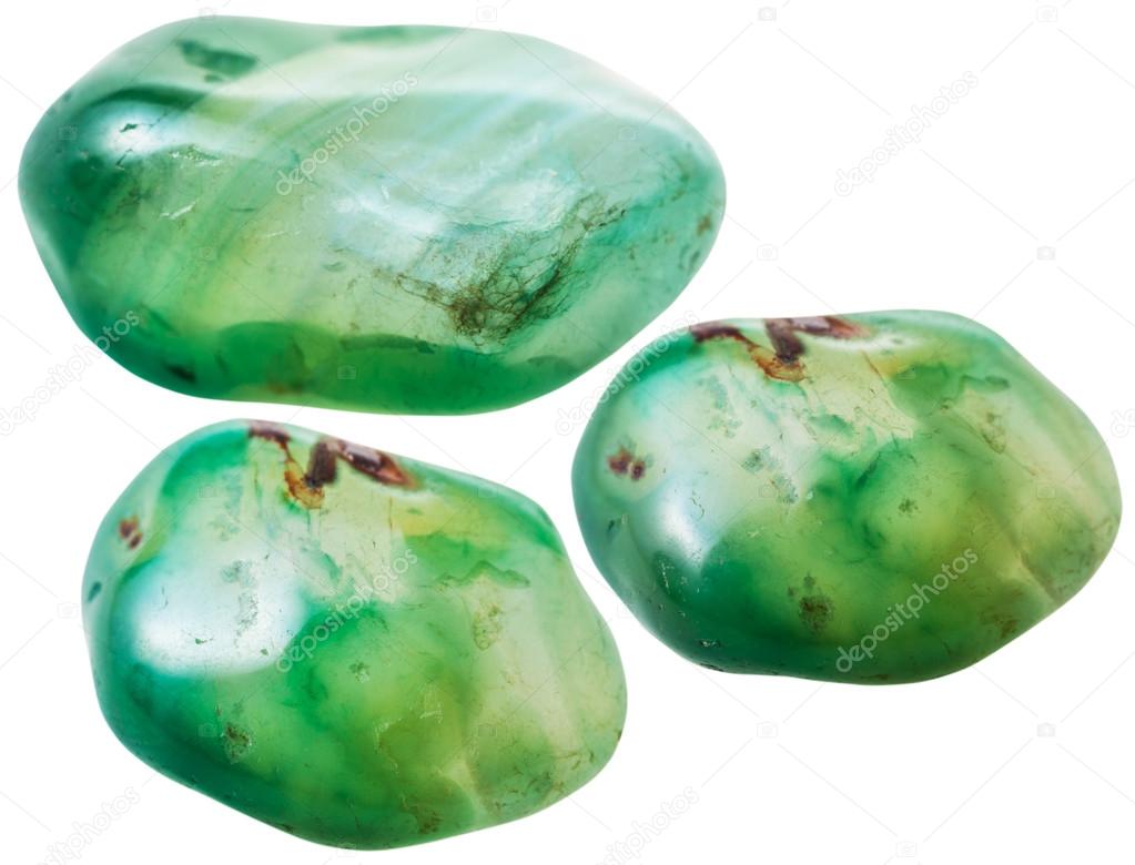 three green toned agate gemstones isolated
