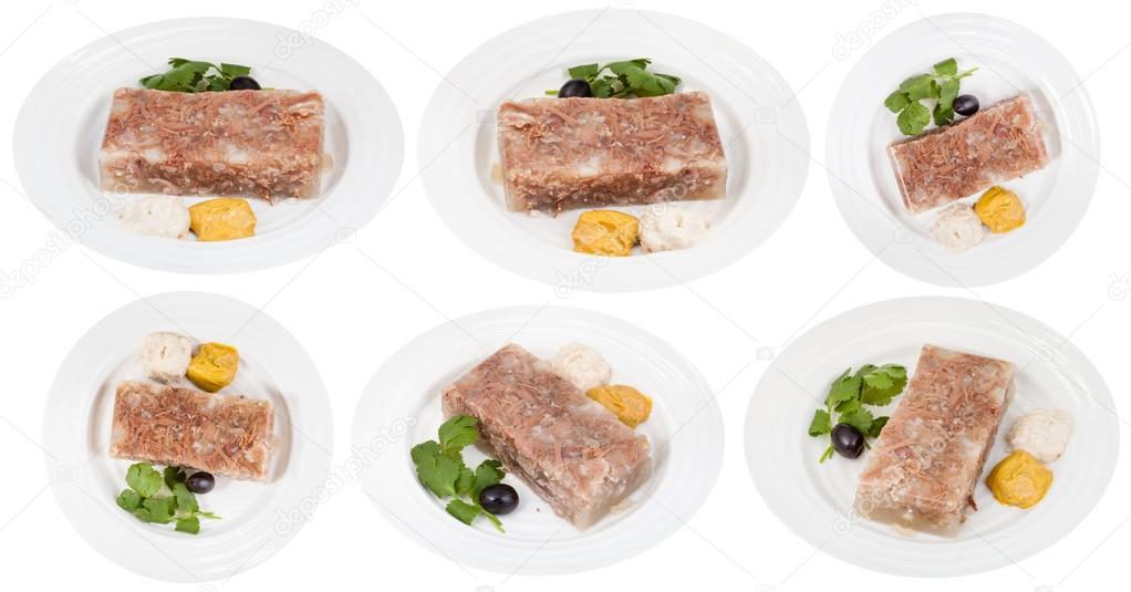 set of white plates with beef aspic isolated