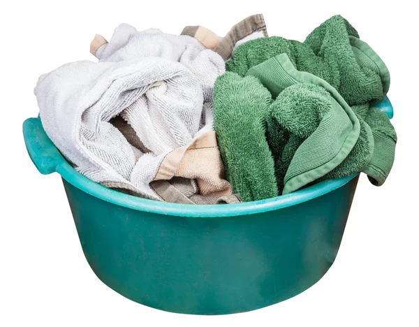 Round green plastic wash basin with dirty clothes — Stock Photo, Image