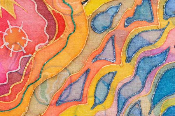 Adorno abstracto amarillo, rojo, azul sobre batik de seda —  Fotos de Stock