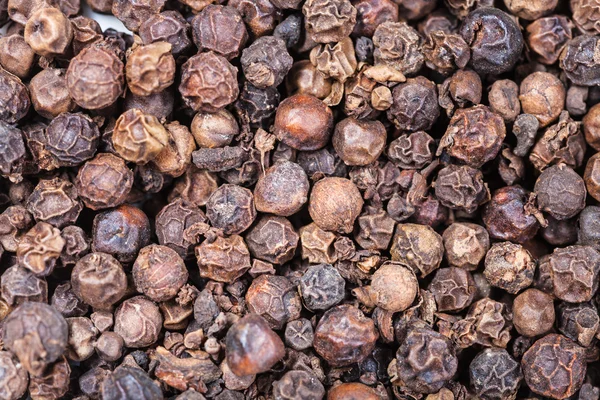 Many dried Black pepper peppercorns — Stock Photo, Image