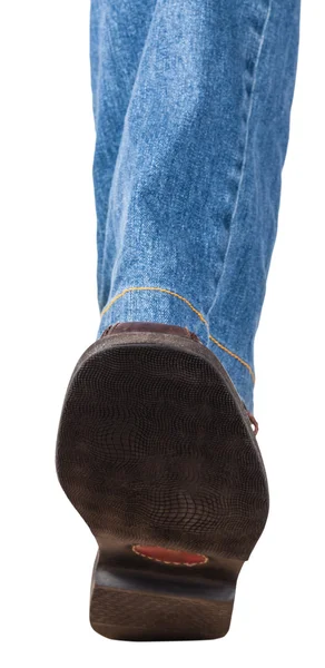 Direct view of left leg in jeans and brown shoe — Stock Photo, Image