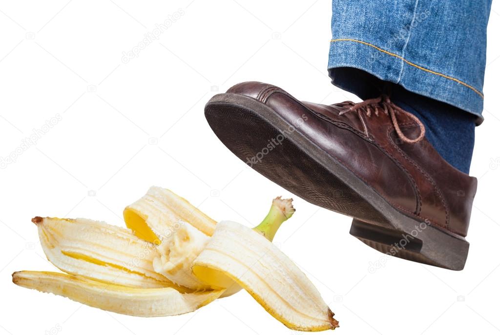 left foot in jeans and shoe slips on banana peel