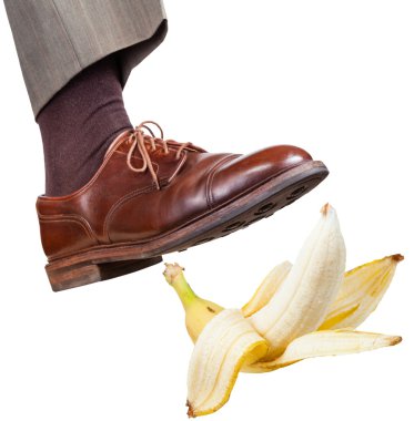 foot in the right brown shoe slips on banana peel clipart