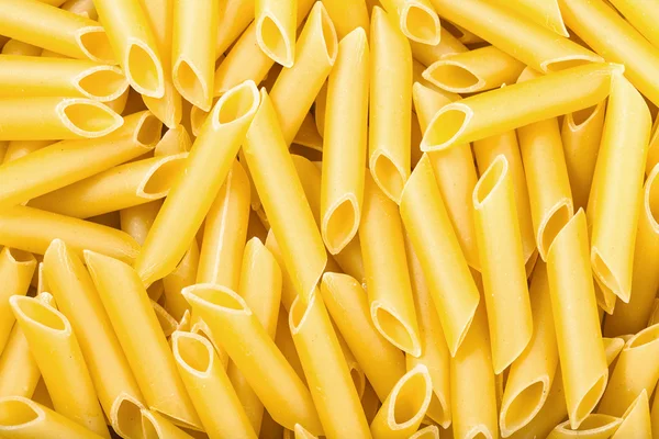 Många durum vete mannagryn pasta penne lisce — Stockfoto