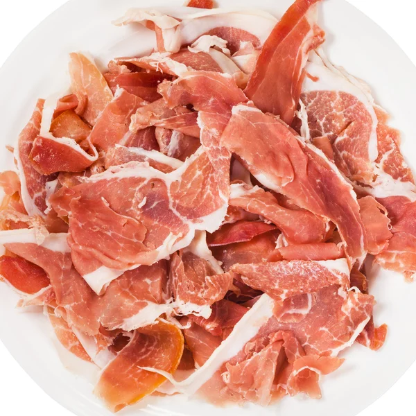 Bovenaanzicht van dun gesneden dry cured ham op plaat — Stockfoto